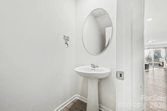 a bathroom with a sink a mirror and vanity