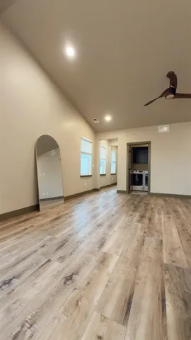 a view of empty room with a fireplace