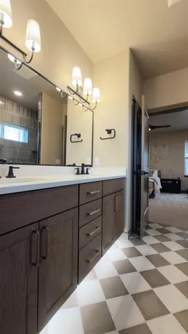 a spacious bathroom with a granite countertop sink a mirror and a