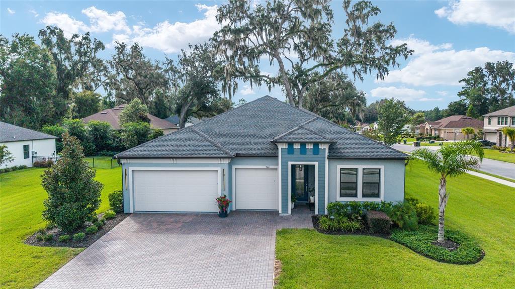 a view of a house with garden and yard