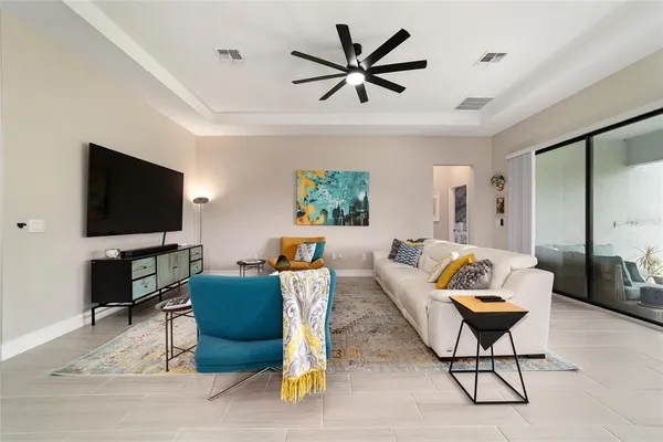 a living room with furniture and a flat screen tv