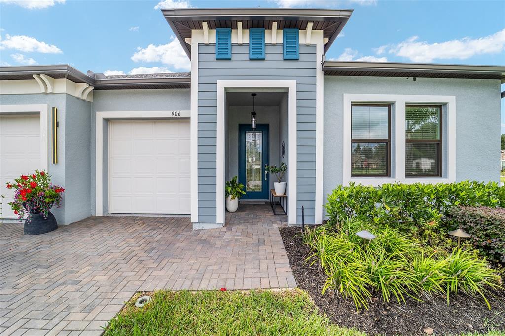 906 Southeast 41st Street Ocala, FL 34480 - Photo 2 of 37 a view of a house with potted plants
