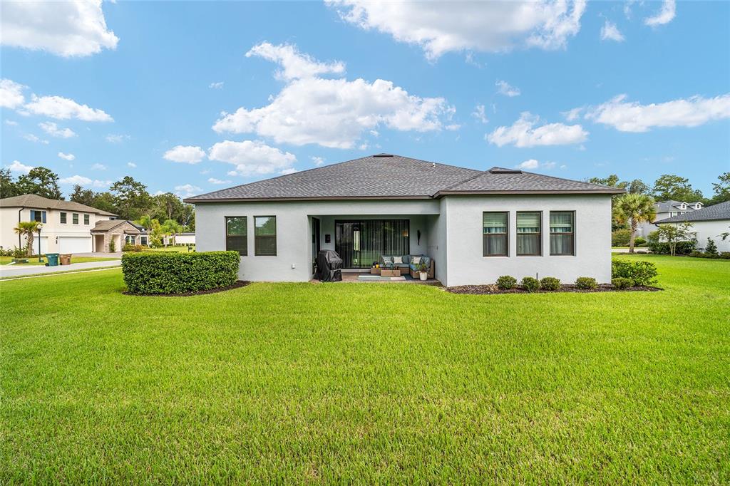 906 Southeast 41st Street Ocala, FL 34480 - Photo 35 of 37 a view of a house with a back yard