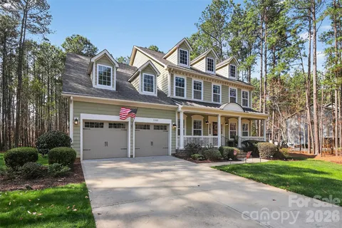 front view of a house with a garden