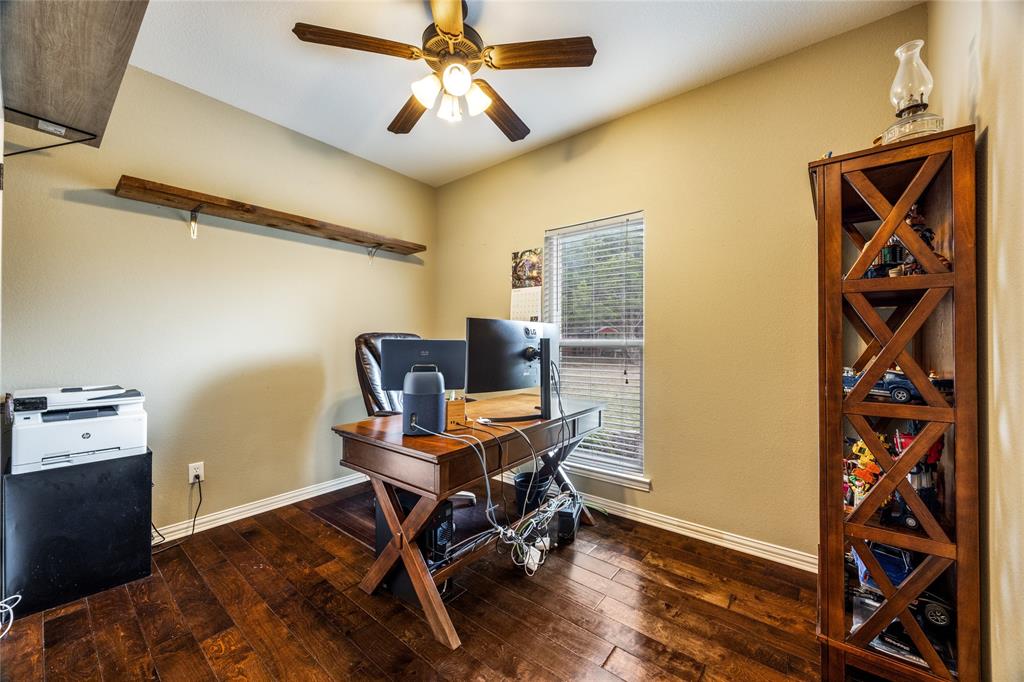 1462 Durham Road Whitewright, TX 75491 - Photo 6 of 40 a workspace with chandelier