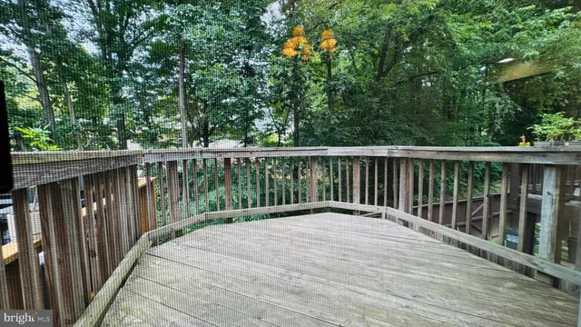 a balcony with trees in front of it