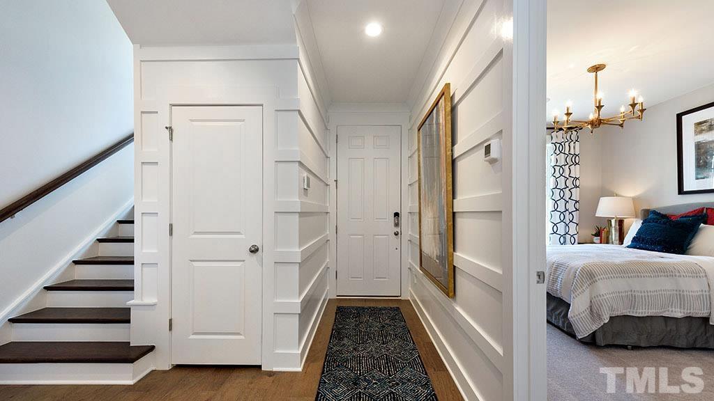 6948 Leesville Road, Unit 14 Raleigh, NC 27613 - Photo 14 of 19 a view of a hallway with a livingroom and stairs