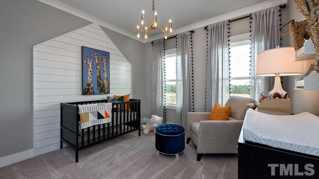 6948 Leesville Road, Unit 14 Raleigh, NC 27613 - Photo 16 of 19 a living room with furniture and a chandelier