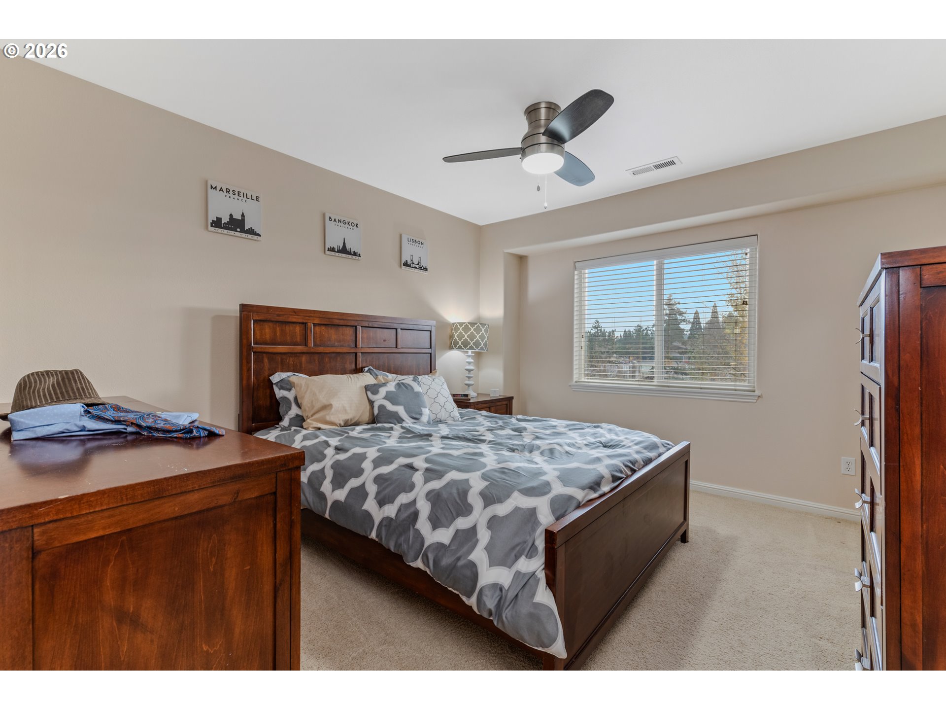 2924 Southwest Tranquility Terrace Beaverton, OR 97003 - Photo 25 of 39 a bedroom with a bed and a dresser
