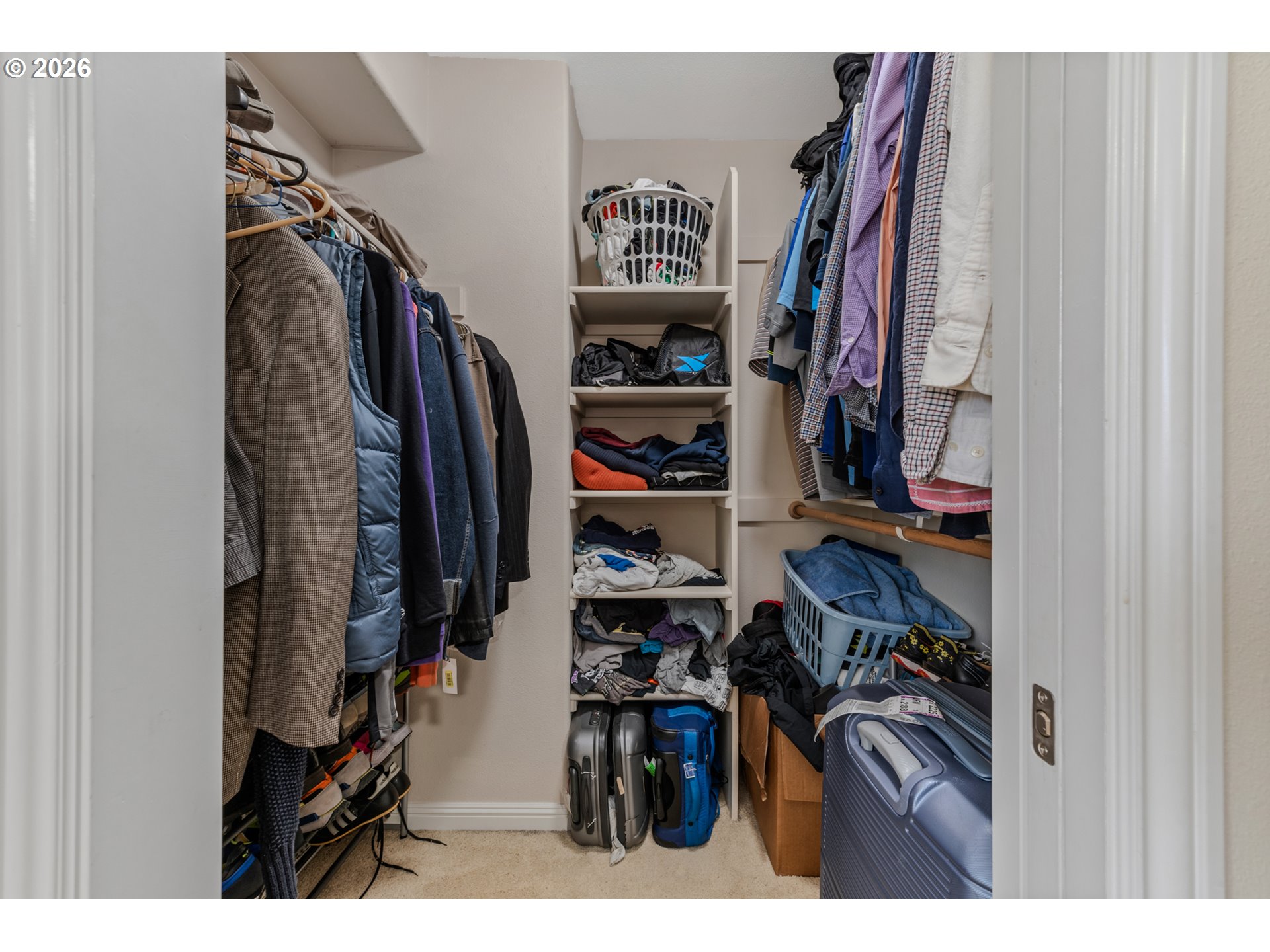 2924 Southwest Tranquility Terrace Beaverton, OR 97003 - Photo 28 of 39 a view of walk in closet with clothes and shoes