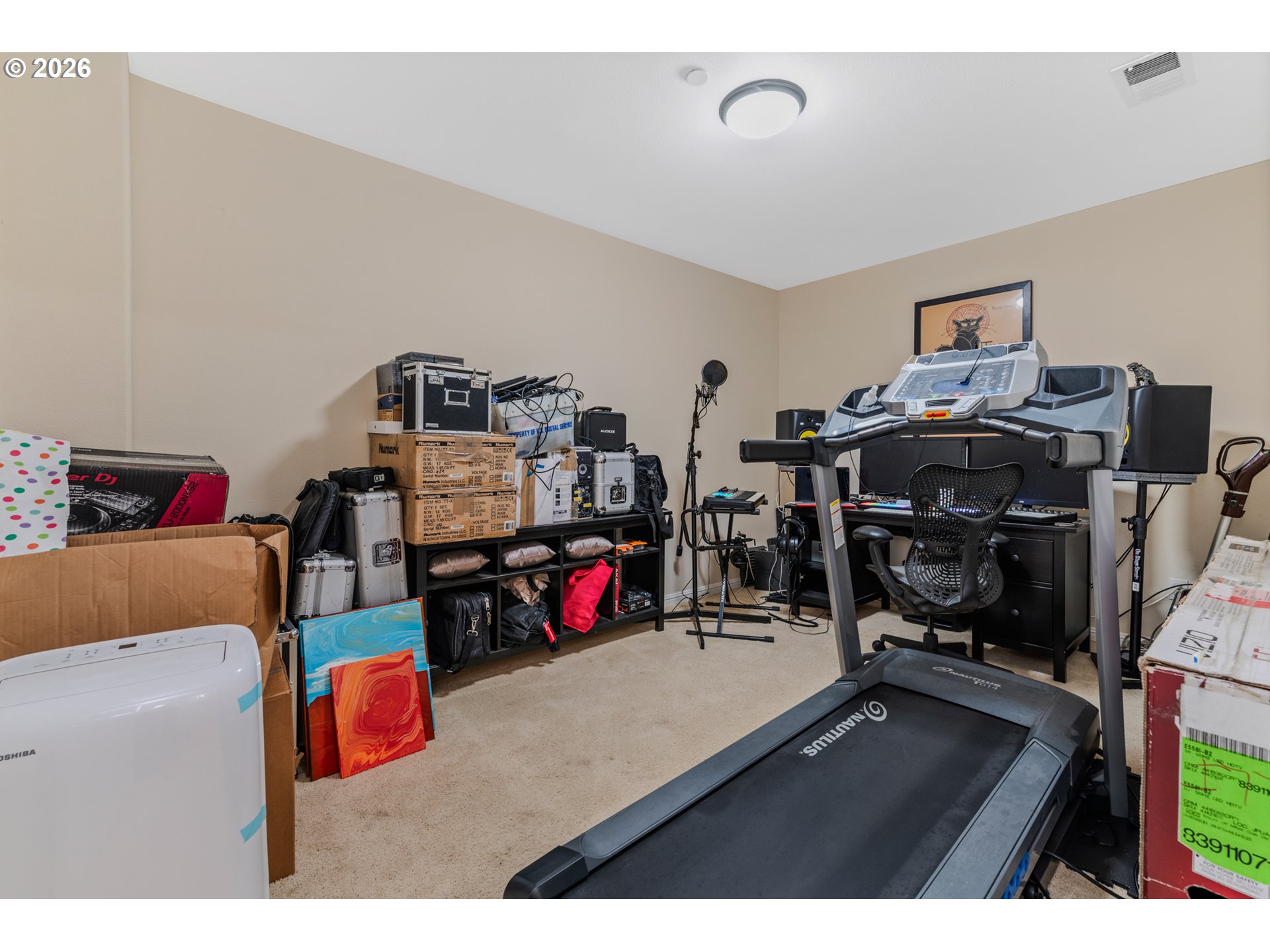 2924 Southwest Tranquility Terrace Beaverton, OR 97003 - Photo 32 of 39 a bedroom with a bed and gym equipment