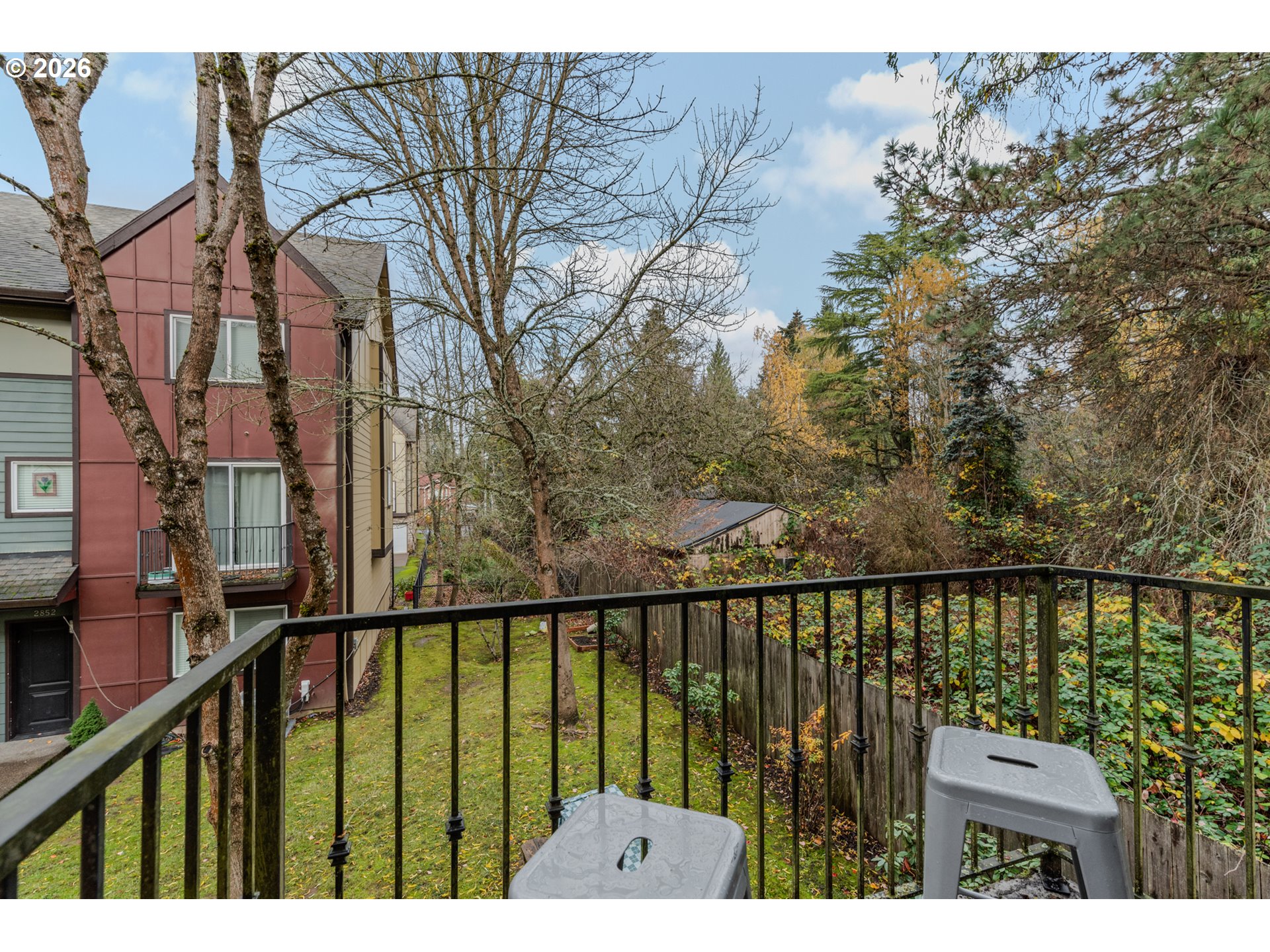 2924 Southwest Tranquility Terrace Beaverton, OR 97003 - Photo 33 of 39 a view of a balcony with wooden floor and fence