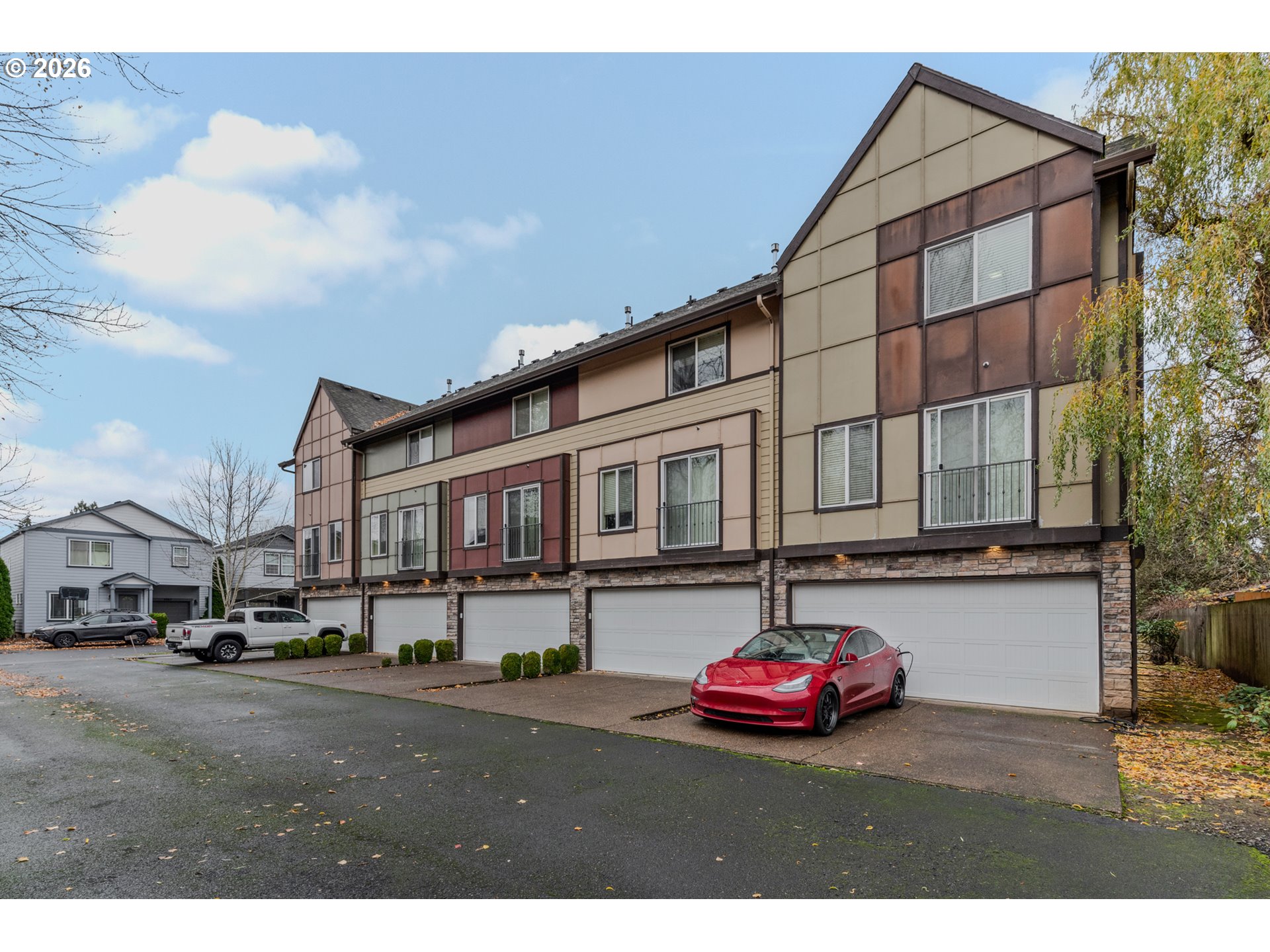 2924 Southwest Tranquility Terrace Beaverton, OR 97003 - Photo 39 of 39 a city street lined with buildings and cars