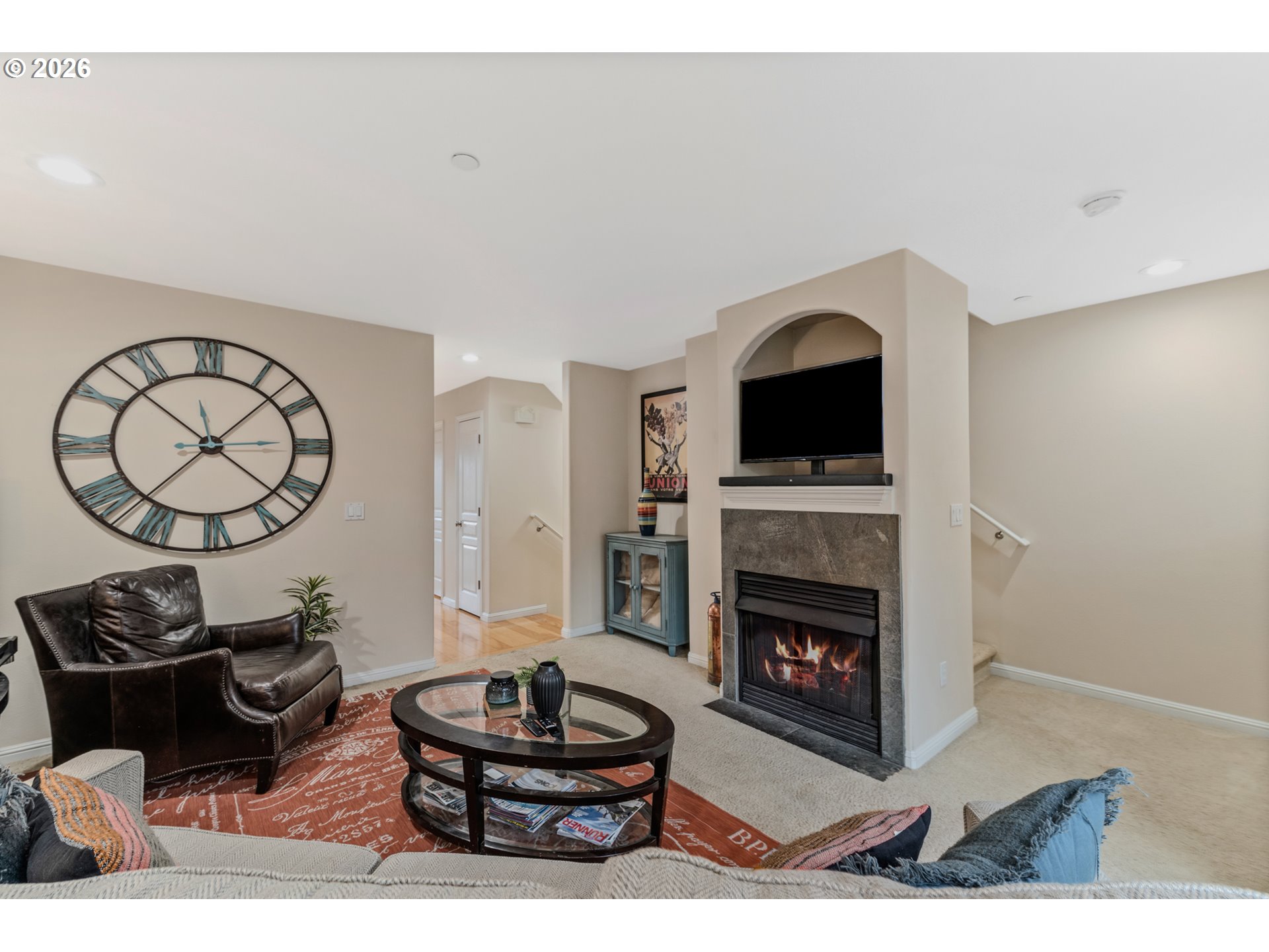 2924 Southwest Tranquility Terrace Beaverton, OR 97003 - Photo 8 of 39 a living room with furniture a fireplace and rug