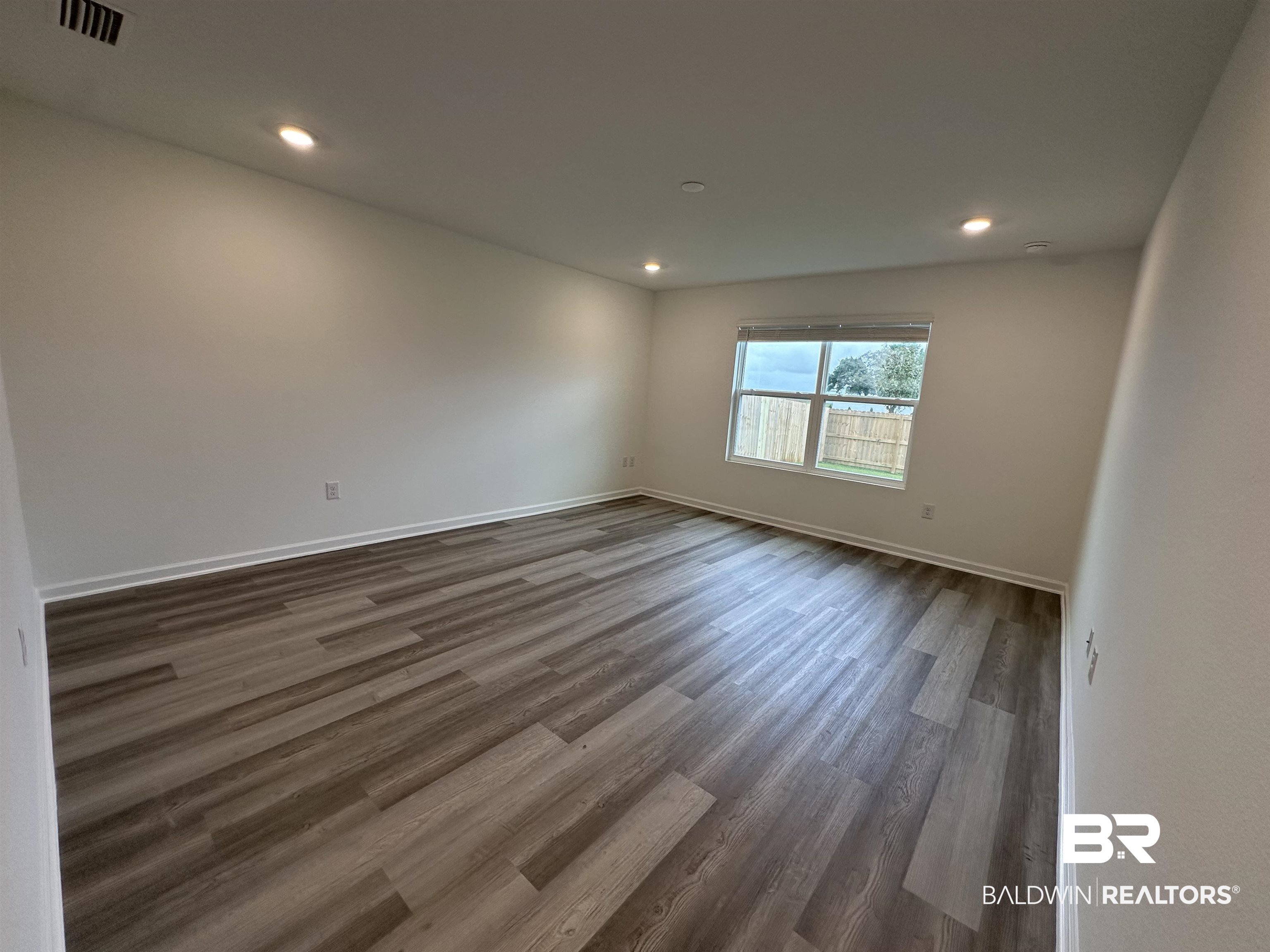 22275 Aleutian Avenue Foley, AL 36535 - Photo 12 of 72 Primary bedroom with dark hardwood / wood-style floors