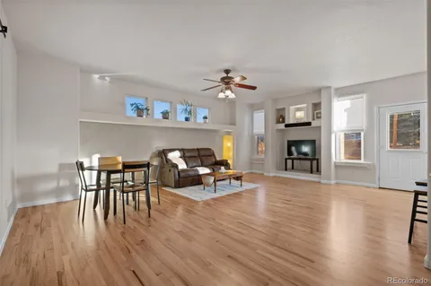 a view of a livingroom with furniture and a fireplace