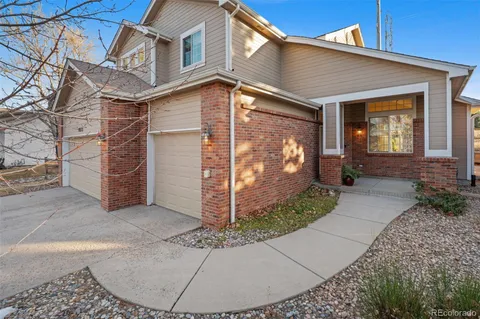 a view of a house with brick walls