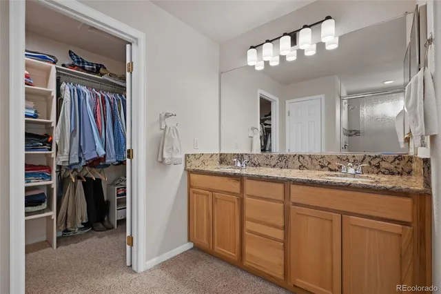 a bathroom with a double vanity sink a and a mirror