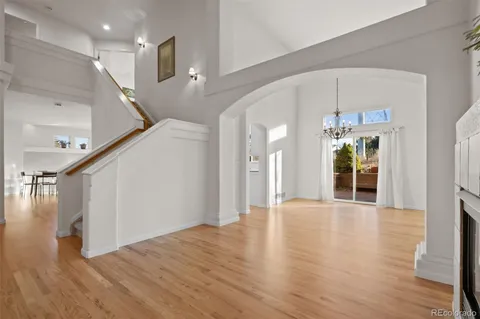 a view of an entryway with wooden floor
