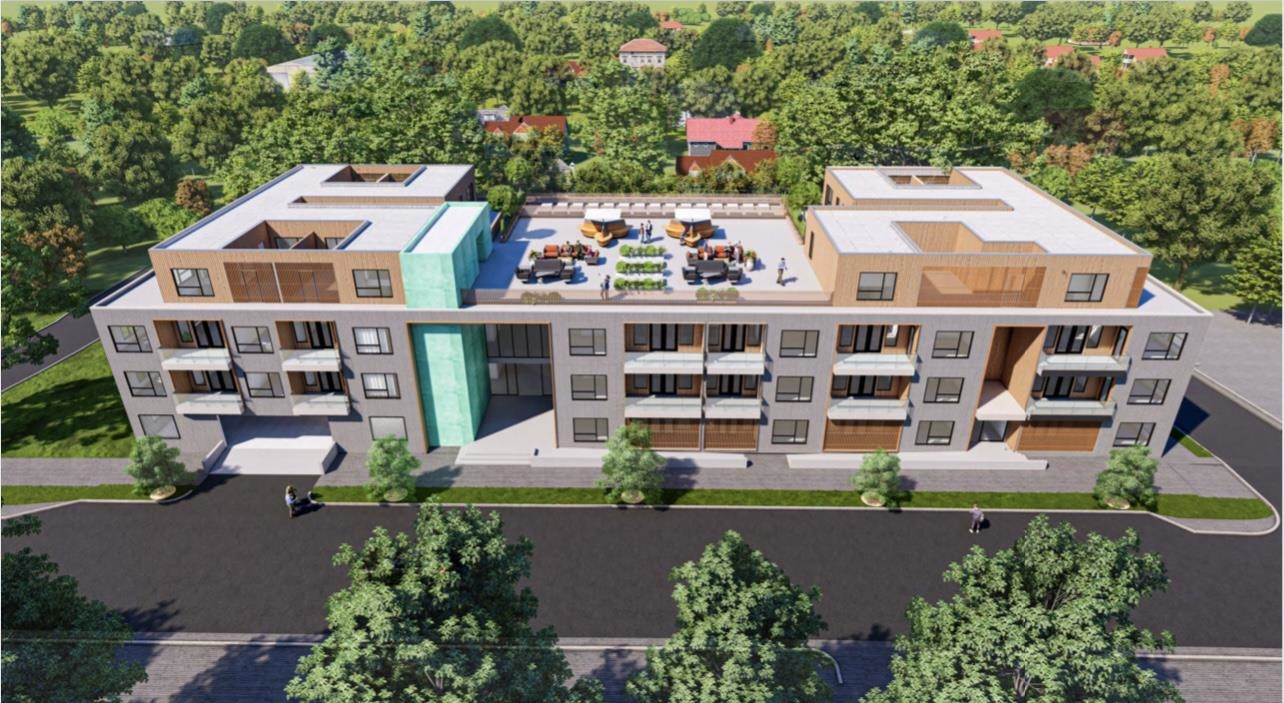 an aerial view of a house with pool and chairs