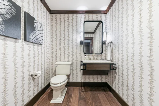 a bathroom with a toilet and a shower curtain