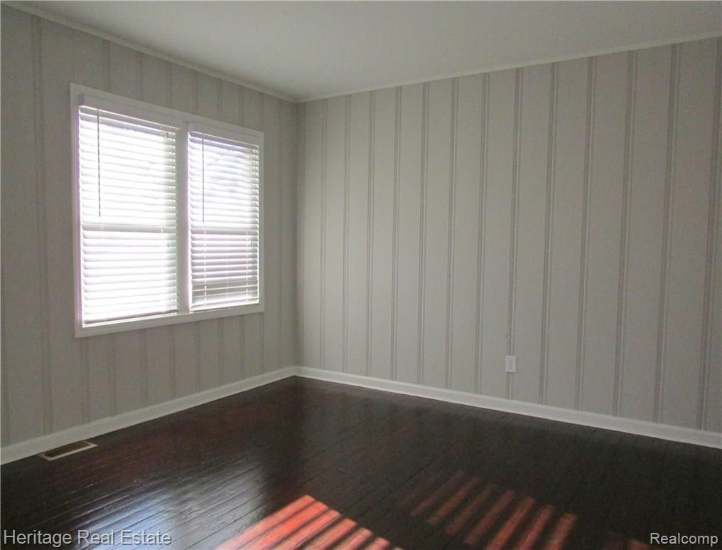 2358 Virginia Avenue Troy, MI 48083 - Photo 12 of 24 Fabulous freshly painted bedroom with beautifully refinished hardwood floors