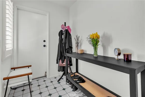 a room with gym equipment and a potted plant