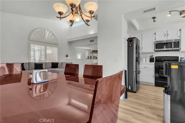 a living room with fireplace furniture and a wooden floor