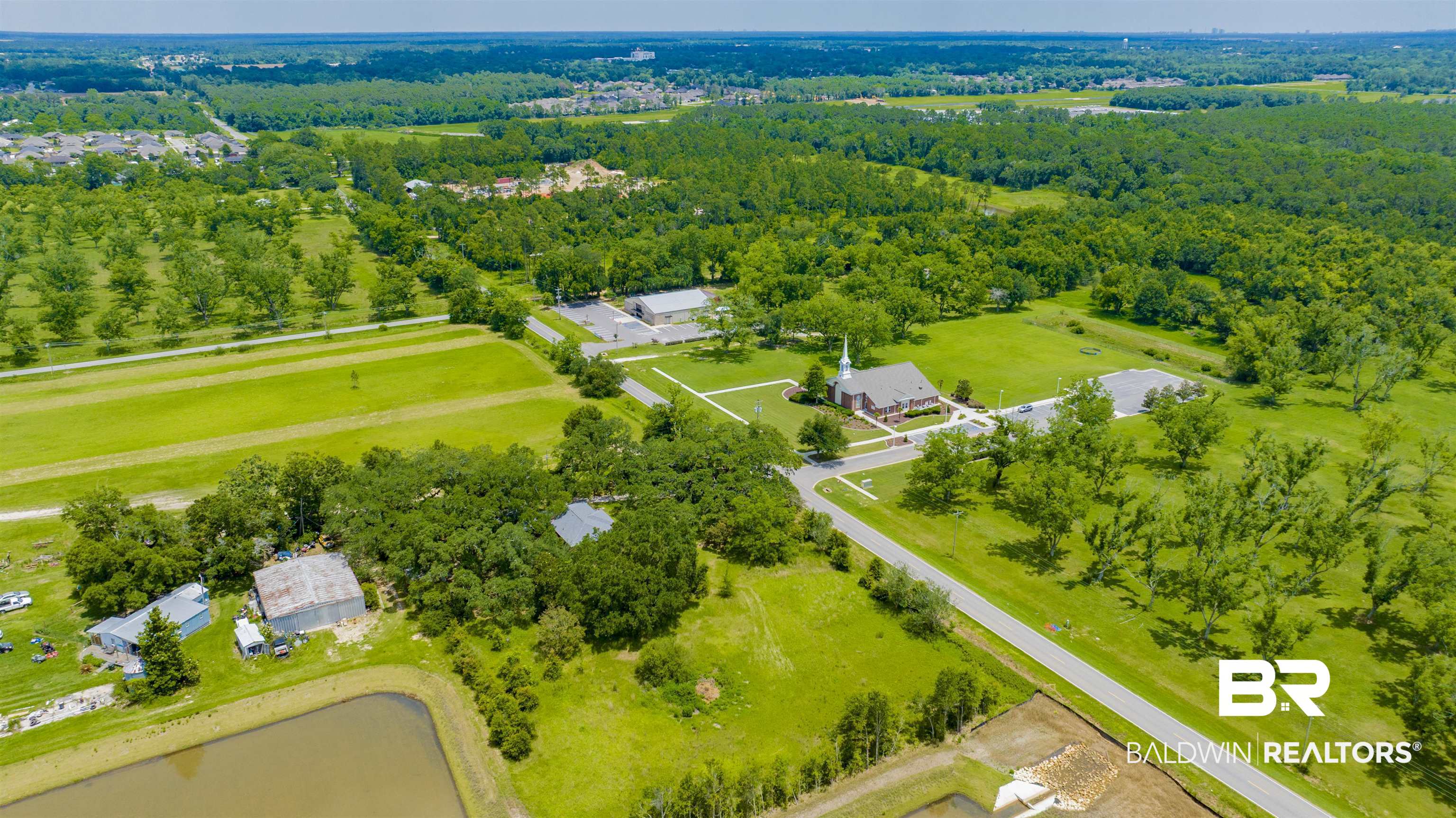 18347 Underwood Road Foley, AL 36535 - Photo 33 of 40 Aerial view of a heavily wooded area