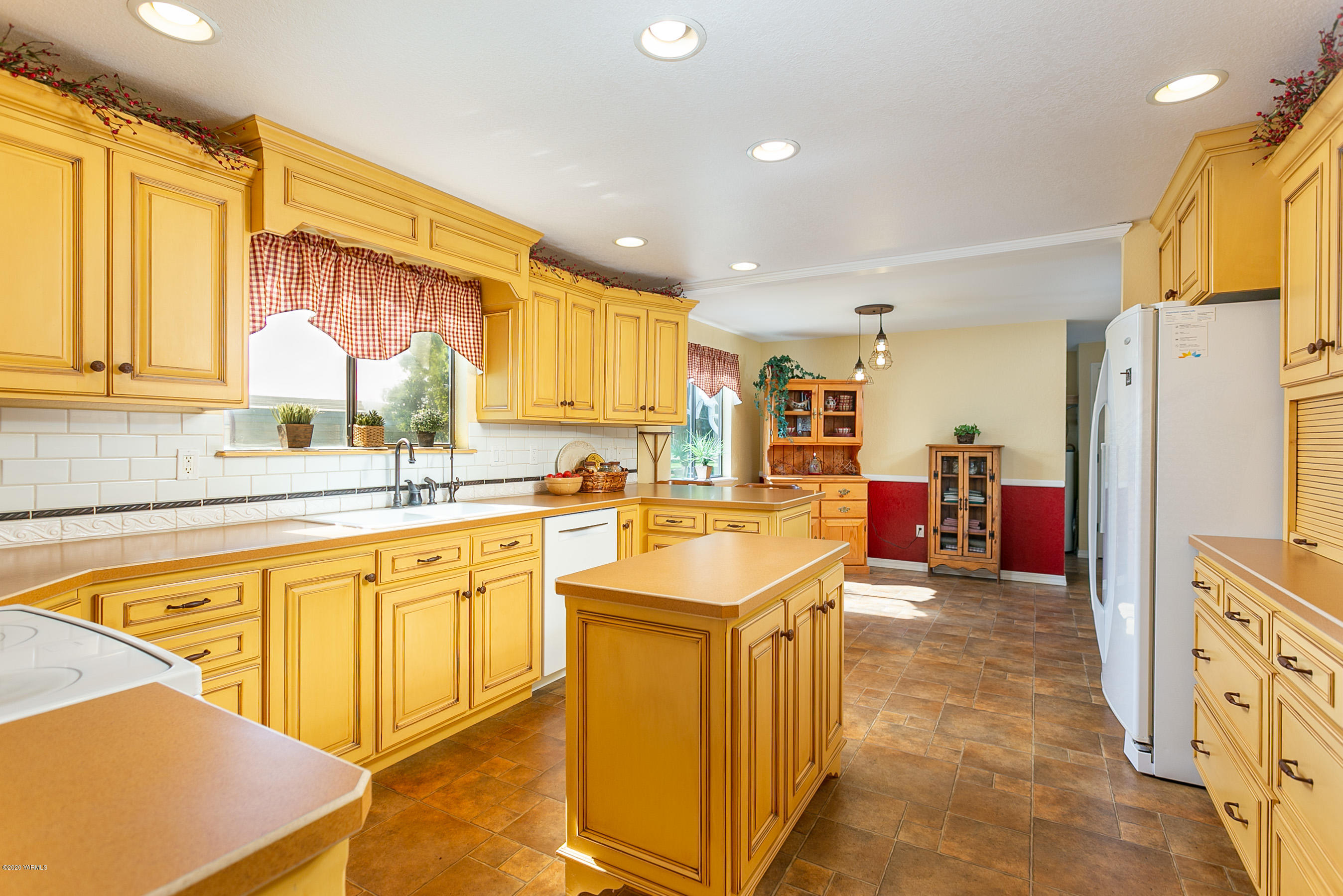 2770 South Satus Road Toppenish, WA 98948 - Photo 5 of 41 a large kitchen with stainless steel appliances granite countertop a sink and cabinets