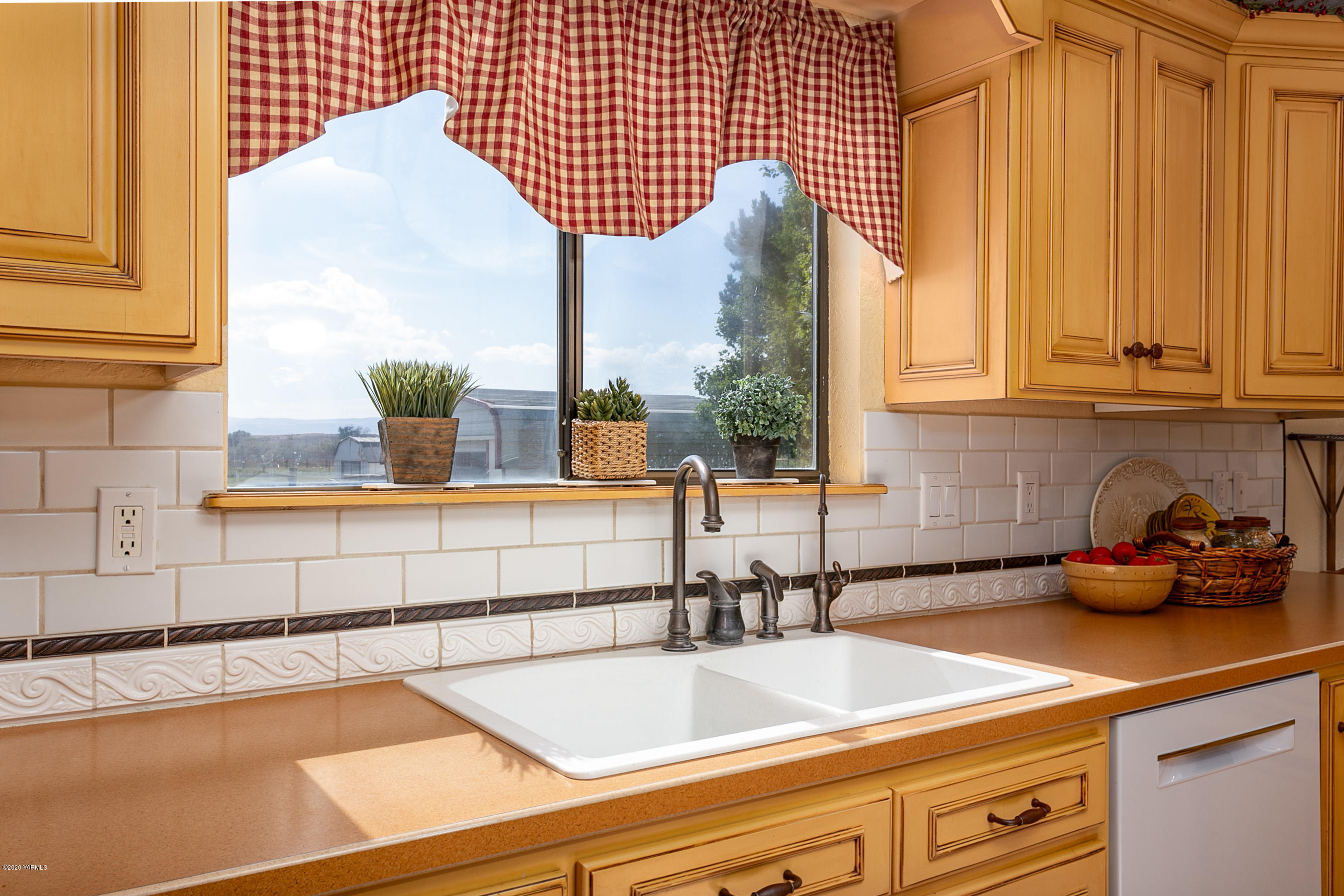 2770 South Satus Road Toppenish, WA 98948 - Photo 8 of 41 a kitchen with a sink and a window