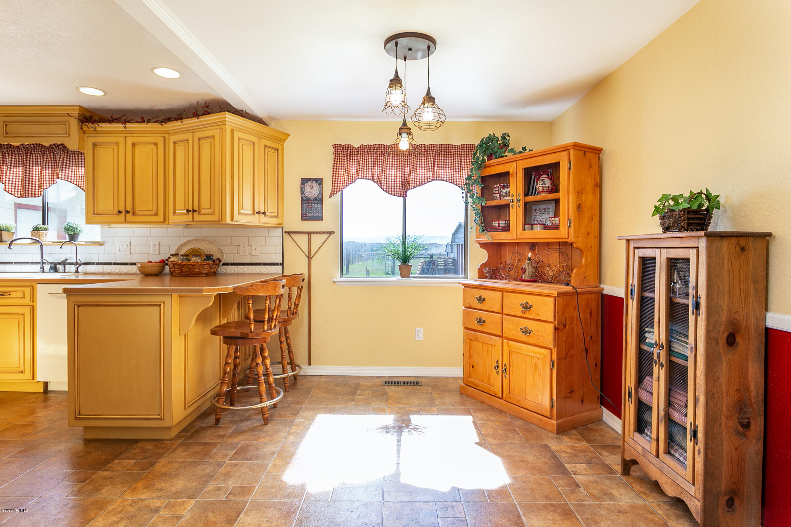 2770 South Satus Road Toppenish, WA 98948 - Photo 10 of 41 a kitchen with refrigerator a stove a sink and cabinets