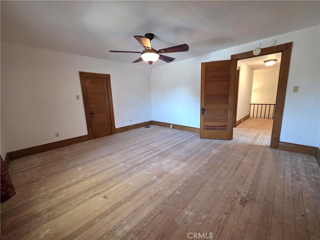 1414 Marin Street Corning, CA 96021 - Photo 23 of 43 a view of empty room with wooden floor