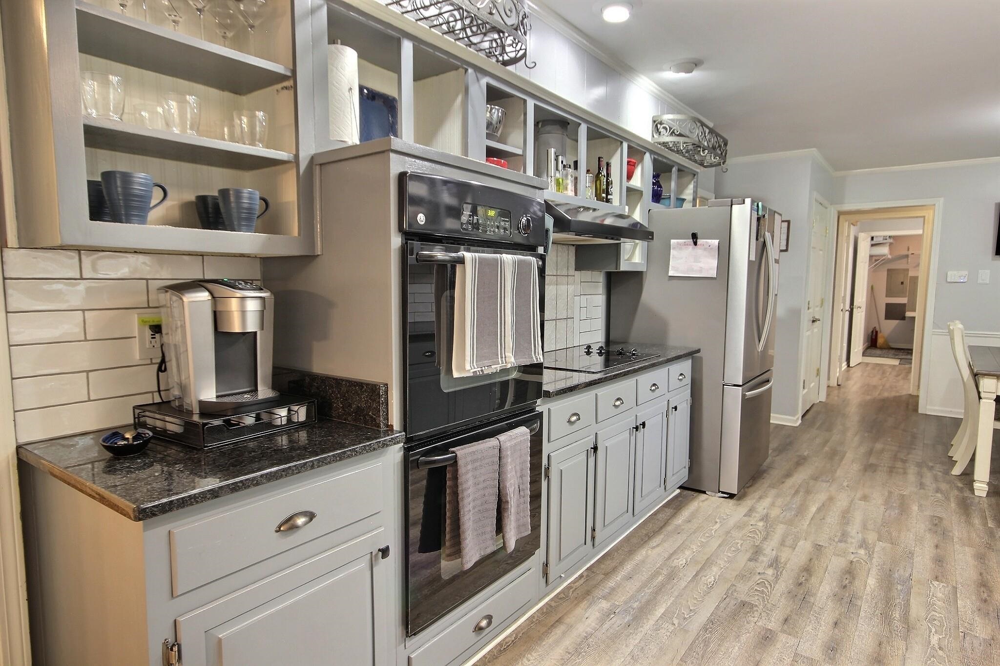 177 South Walnut Bend Road Memphis, TN 38018 - Photo 11 of 34 a kitchen with stainless steel appliances granite countertop a stove and a refrigerator
