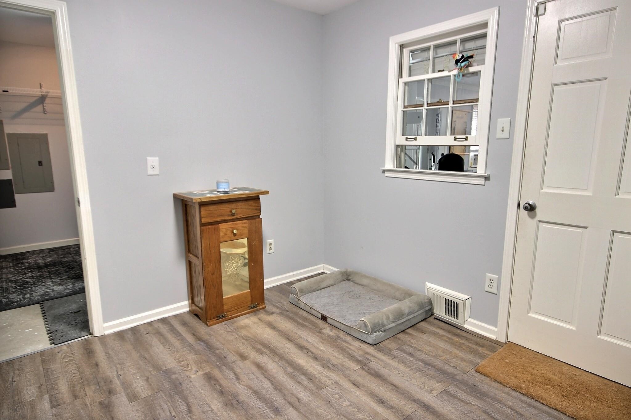 177 South Walnut Bend Road Memphis, TN 38018 - Photo 15 of 34 an empty room with wooden floor and windows