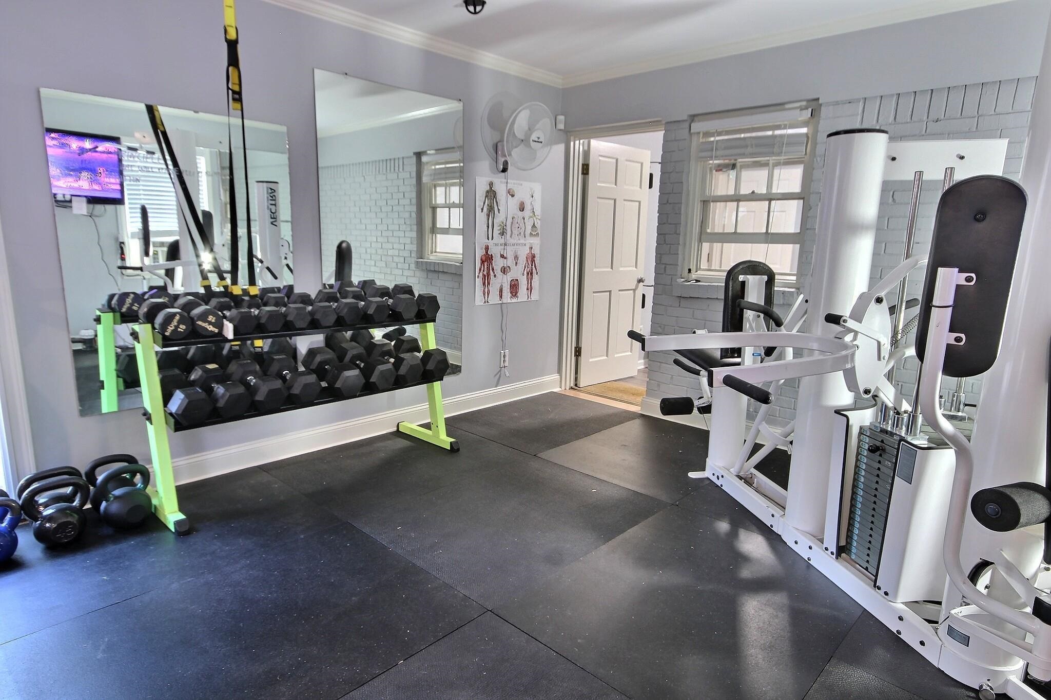177 South Walnut Bend Road Memphis, TN 38018 - Photo 17 of 34 a bed room with gym equipment and a window