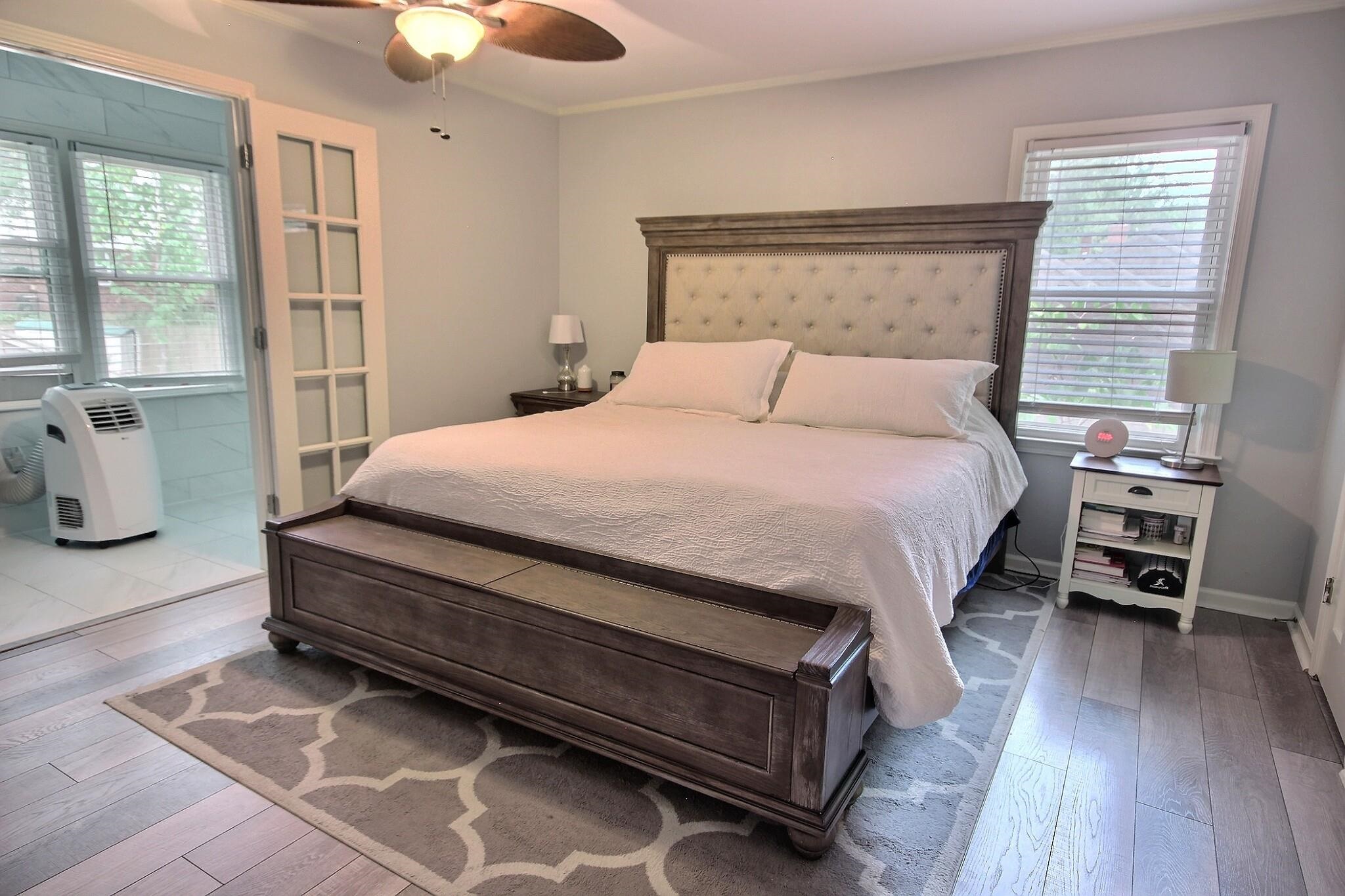 177 South Walnut Bend Road Memphis, TN 38018 - Photo 21 of 34 a bedroom with a bed and wooden floor