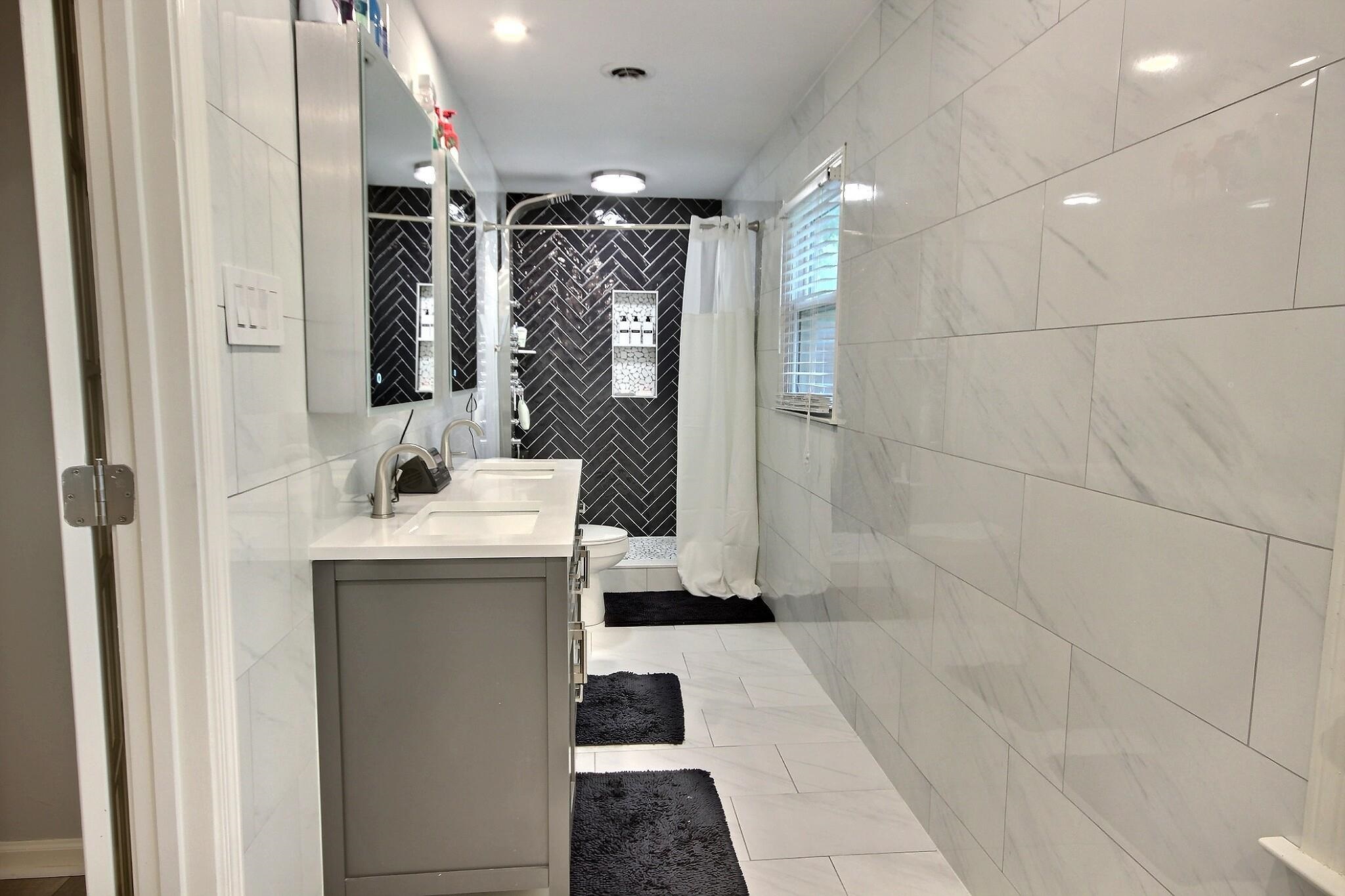 177 South Walnut Bend Road Memphis, TN 38018 - Photo 22 of 34 a bathroom with a sink and mirror with shower