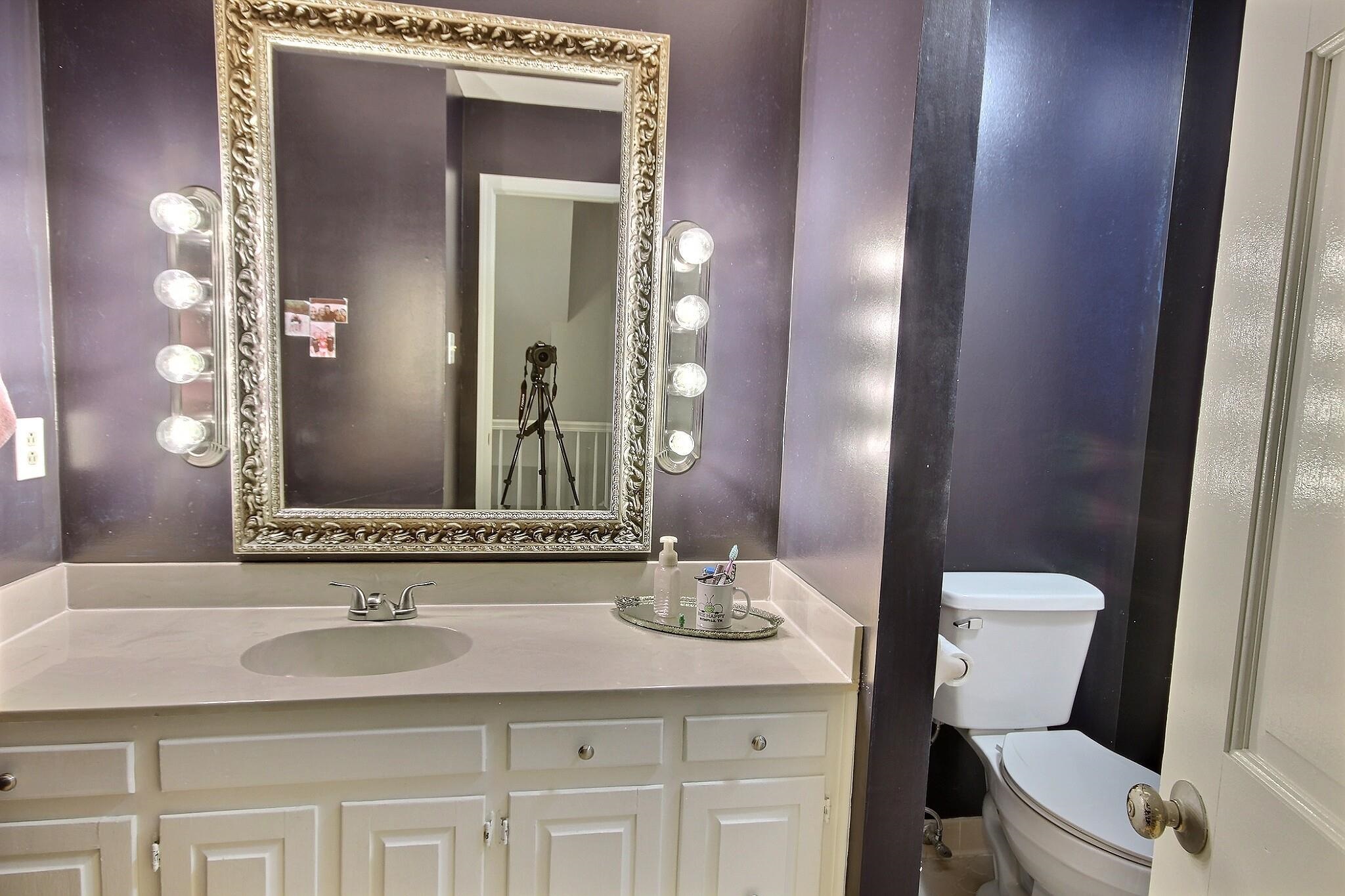 177 South Walnut Bend Road Memphis, TN 38018 - Photo 25 of 34 a bathroom with a toilet a sink and mirror