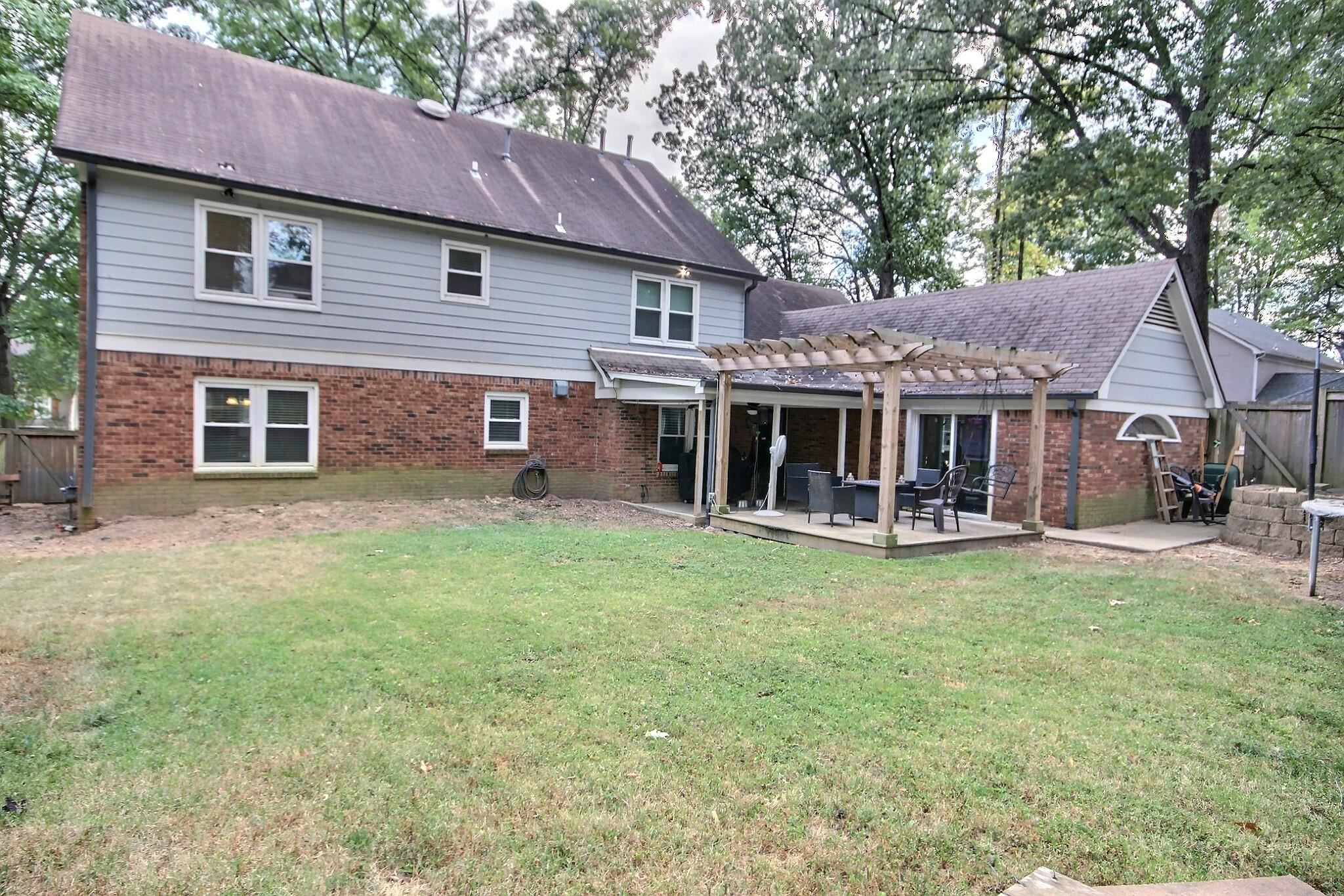 177 South Walnut Bend Road Memphis, TN 38018 - Photo 32 of 34 a view of a house with a yard and sitting area