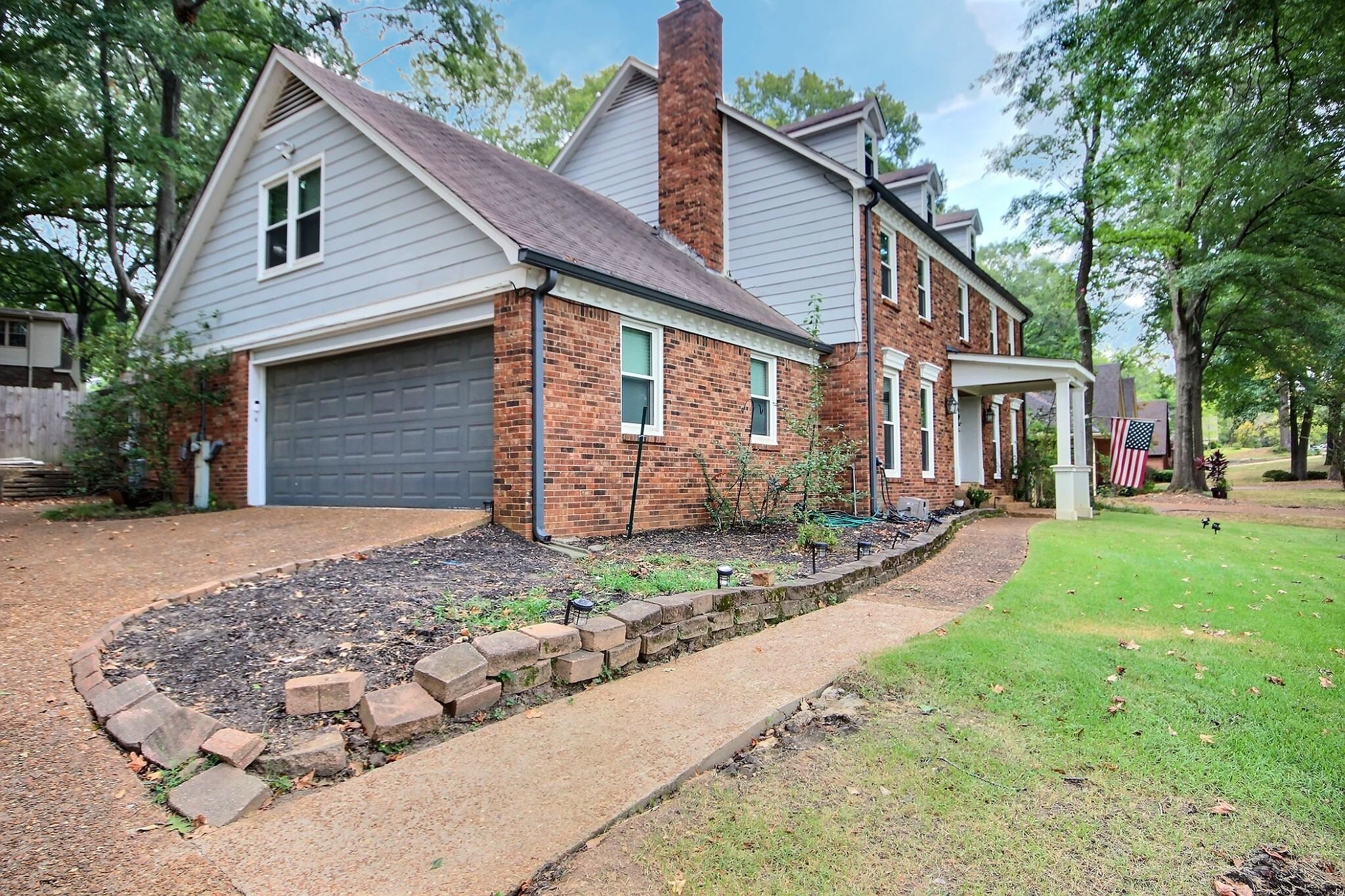 177 South Walnut Bend Road Memphis, TN 38018 - Photo 34 of 34 a front view of a house with garden