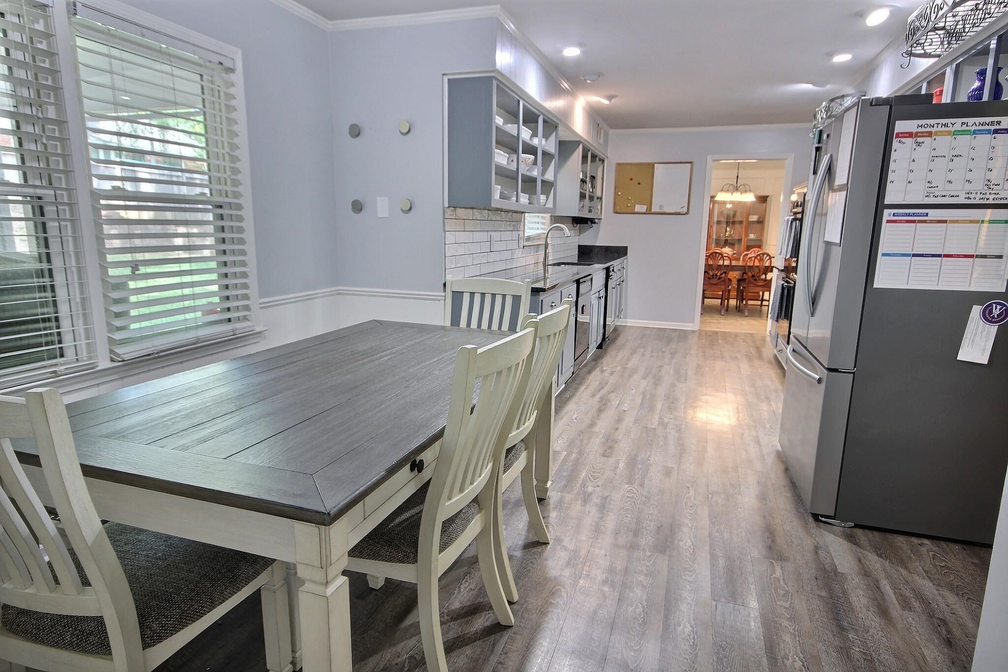 177 South Walnut Bend Road Memphis, TN 38018 - Photo 9 of 34 a dining room with furniture and wooden floor