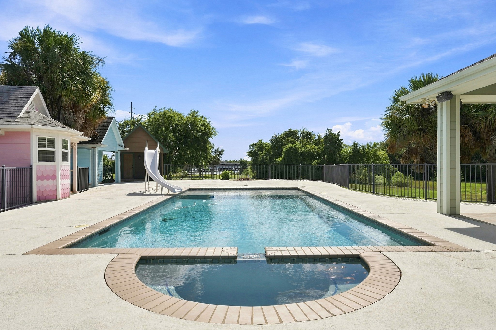 2904 Red Bluff Road Seabrook, TX 77586 - Photo 5 of 47 Beautiful heated pool and spa area with three guest cabins, covered patio, and a full bathroom.
