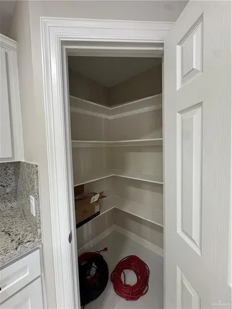 a utility room with a wooden floor