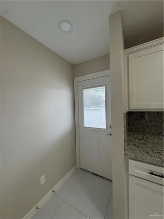 a view of a kitchen cabinets and a window