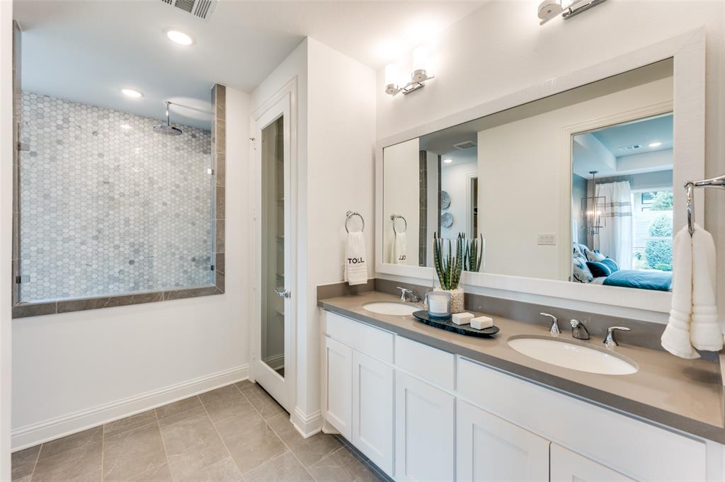 1116 Lakeview Lane Argyle, TX 76226 - Photo 13 of 40 a bathroom with double vanity sinks and a mirror