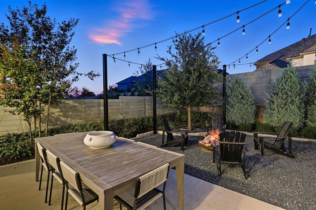1116 Lakeview Lane Argyle, TX 76226 - Photo 29 of 40 a view of a patio with table and chairs and potted plants