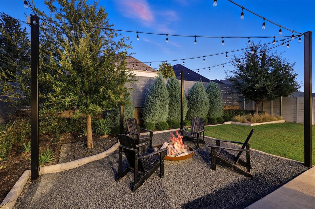 1116 Lakeview Lane Argyle, TX 76226 - Photo 31 of 40 a view of a patio with table and chairs under an umbrella