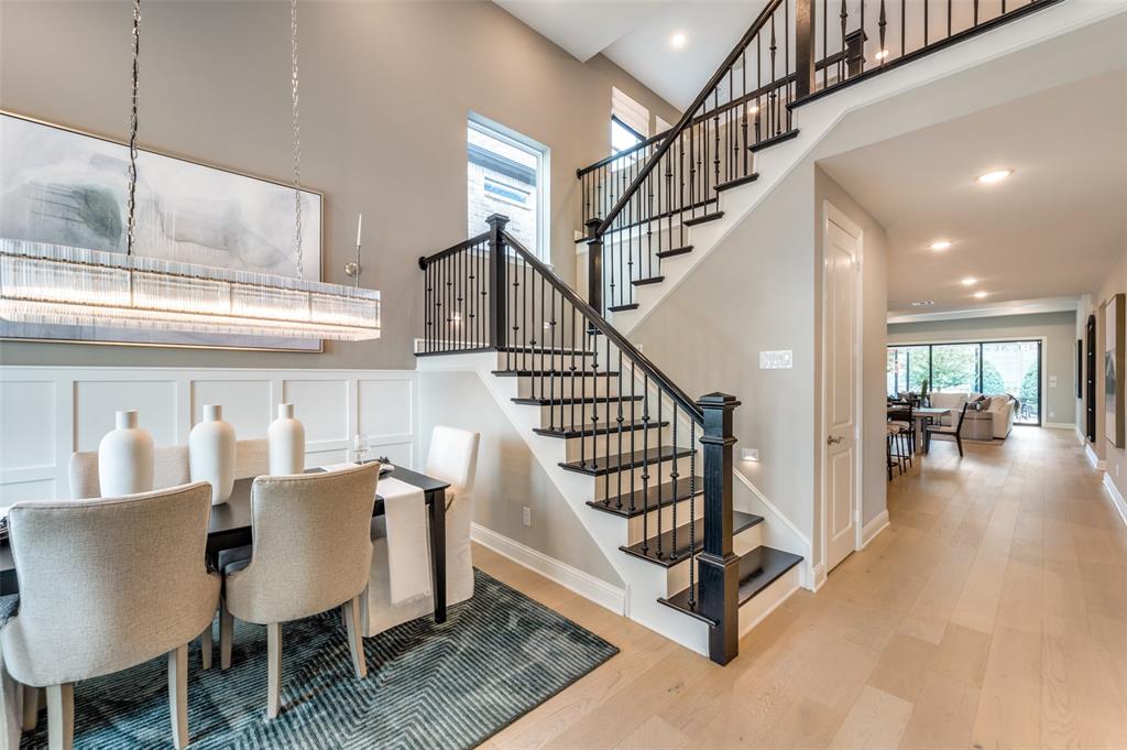 1116 Lakeview Lane Argyle, TX 76226 - Photo 10 of 40 a view of a hallway with chairs and a dining table with chandelier