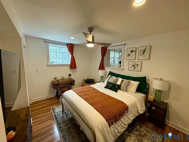a bedroom with a bed and a desk